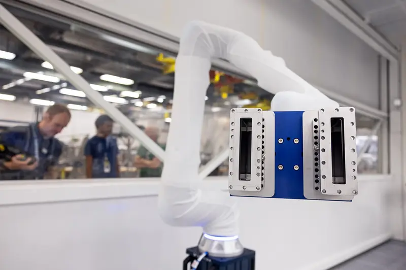 An industrial robot arm on a production line